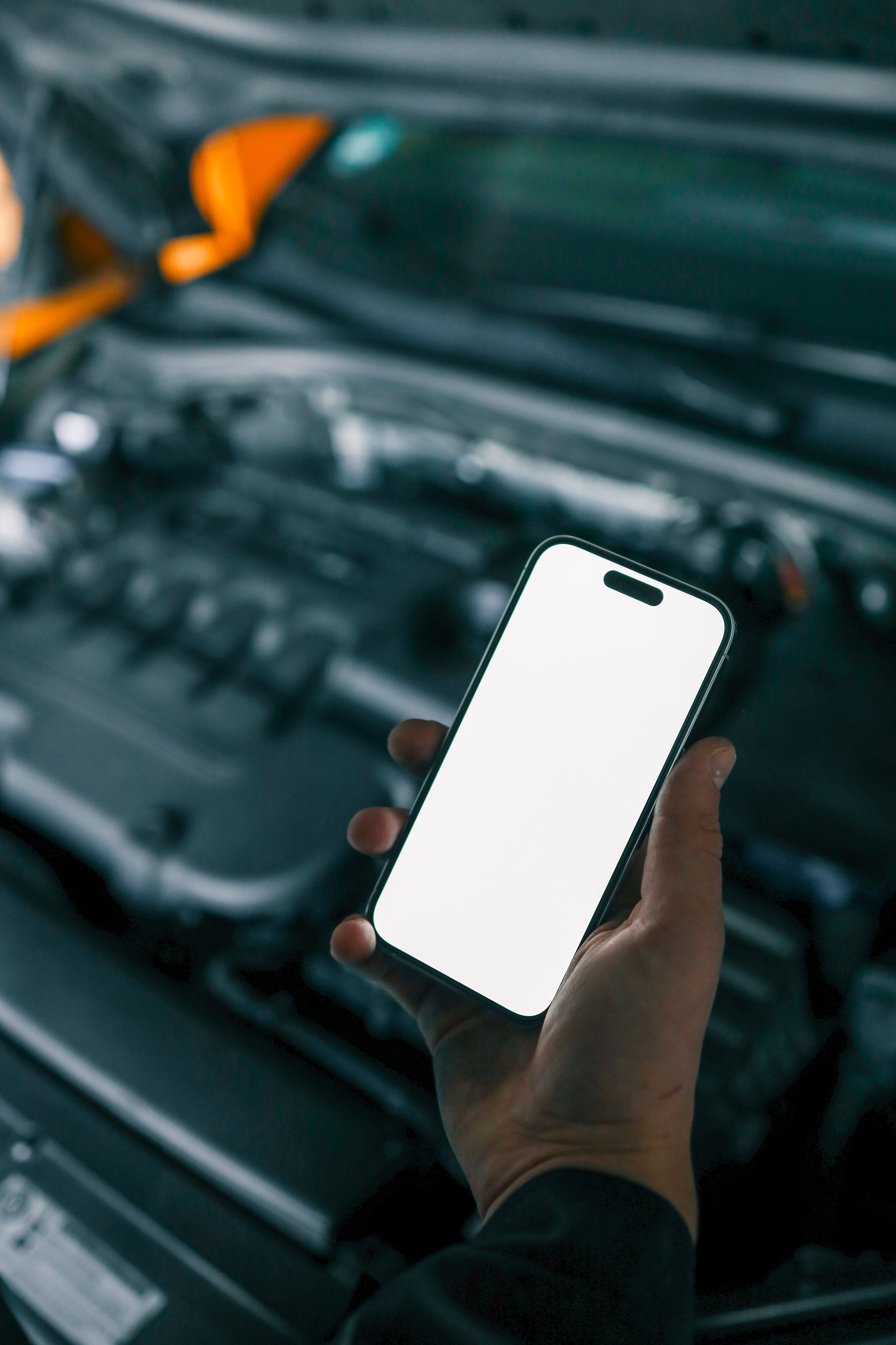 Mobile mechanic working on car